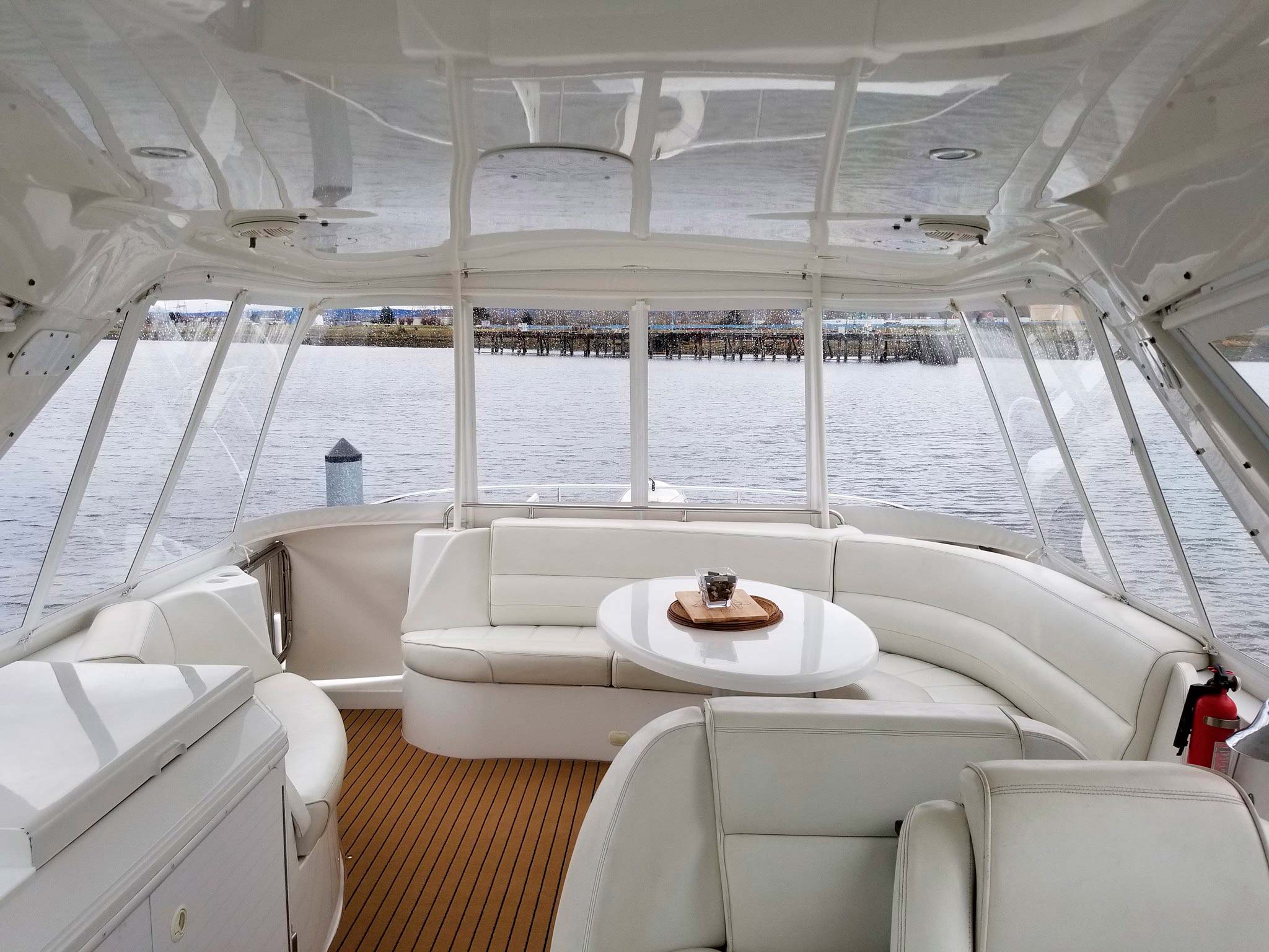 A view of the water through a set of Rainier Marine boat windows.
